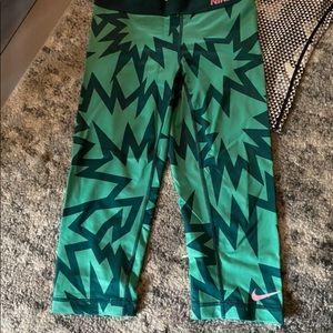 Three pair size small Nike Capri exercise pants in excellent condition